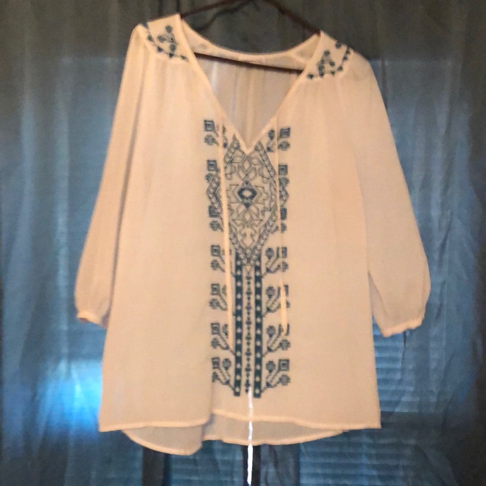 Quarter length white blouse